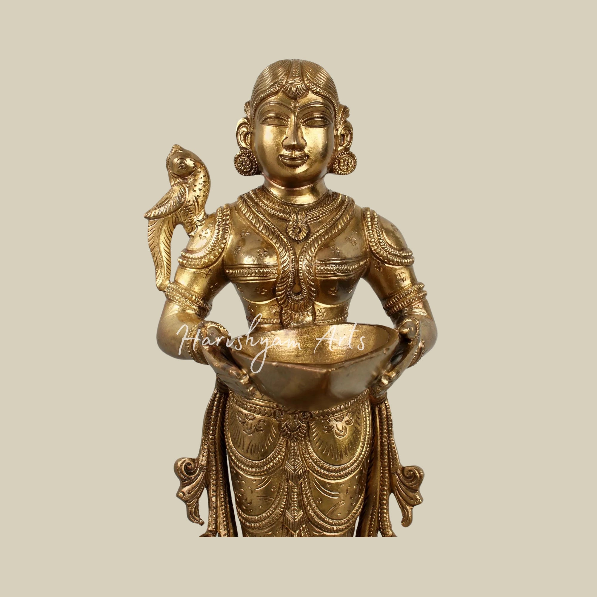 17" Graceful Deepalakshmi Holding a Lamp on a Tray of Lamps1