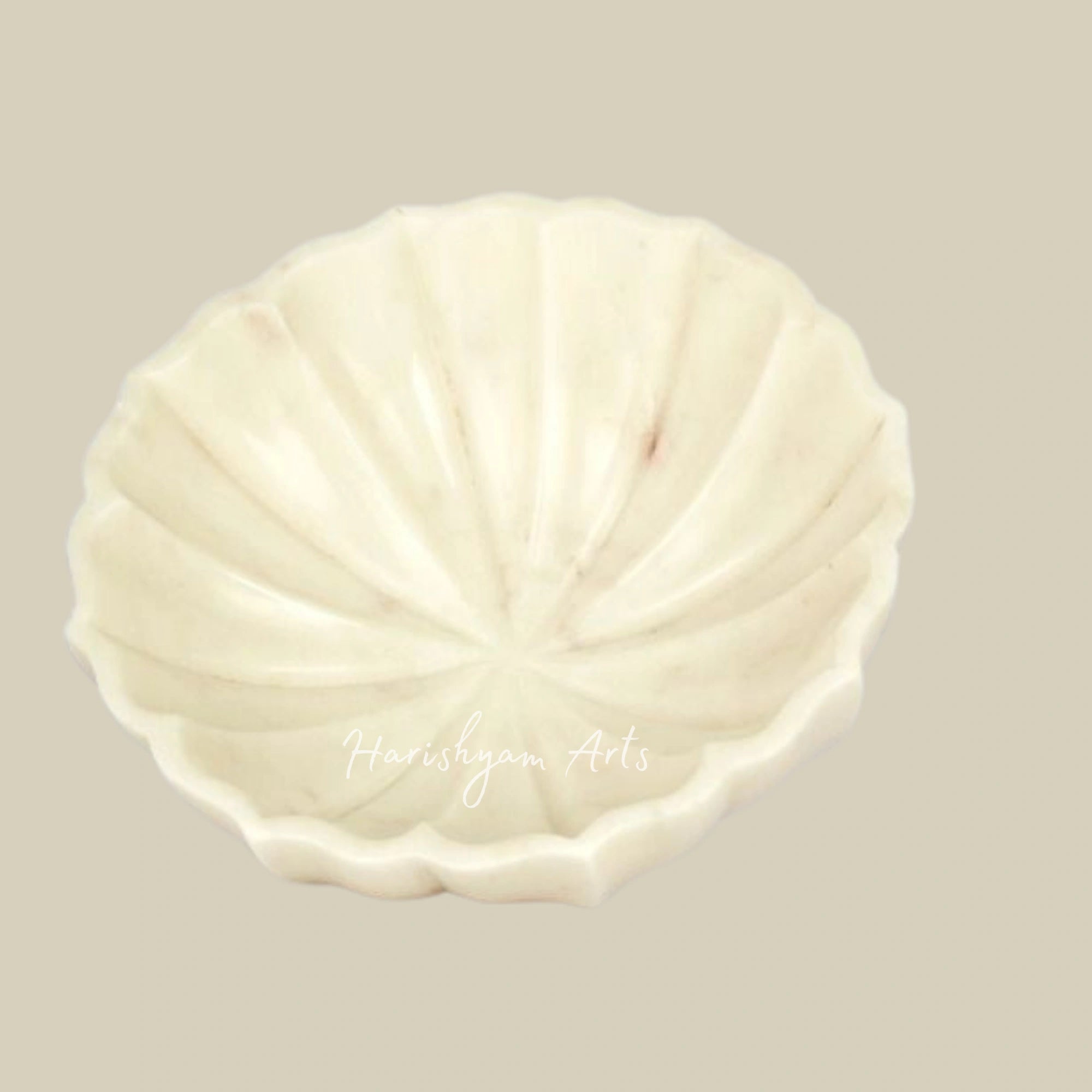 Handcrafted Marble Urli with Intricate Detailing