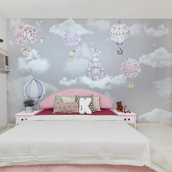 Dreamy Cloud-Themed Kids Bedroom with Pink Upholstered Bed and Wall Mural