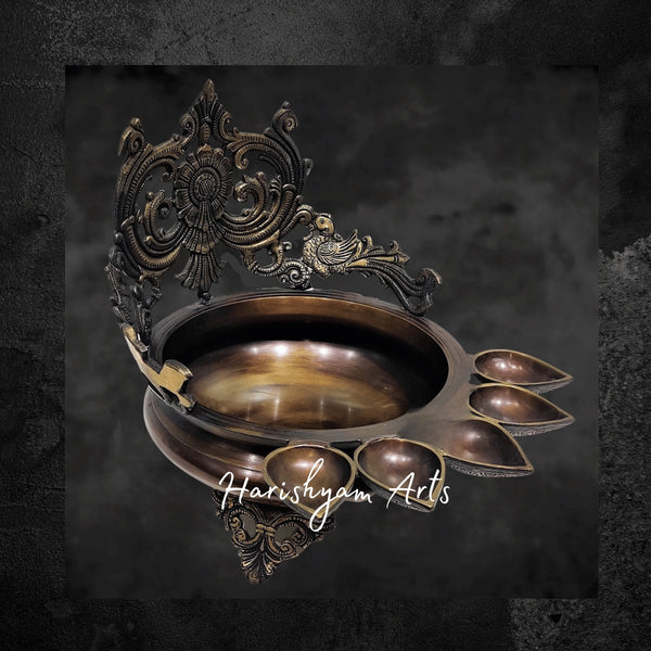 Grand Brass Panchdeep Urli Bowl with Hanging Bells and Engraved Spiral Backdrop
