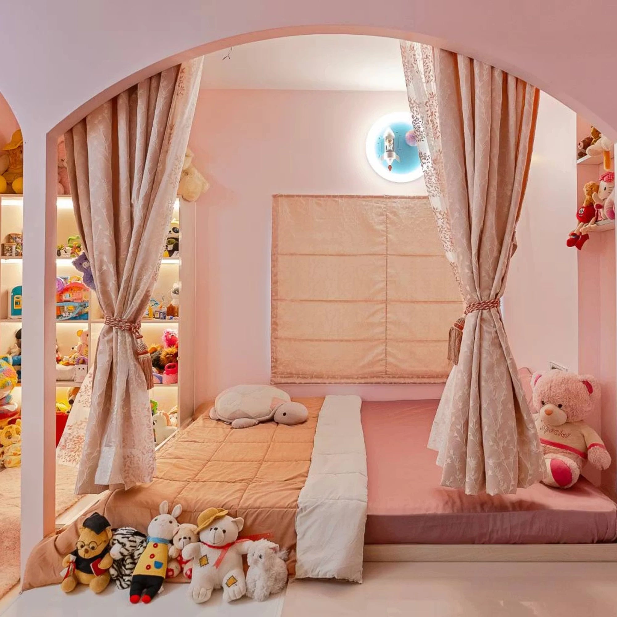 Modern Pink-Themed Kids Room Featuring Storage Units and Soft Curtains