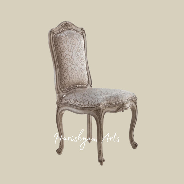 Traditional European Upholstered Chair with Intricate Carvings, Timeless Fabric Design, and Sturdy Wooden Legs